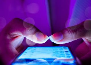 a person using phone in the dark