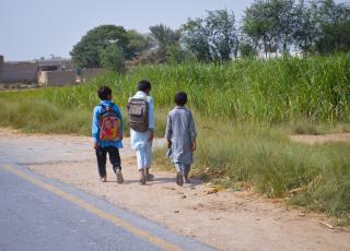 kids walking on road